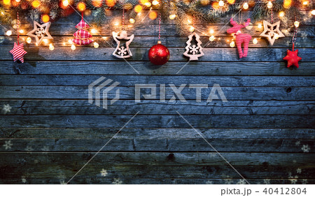 Christmas background with wooden decorations and spot lights. Christmas background with wooden decorations and spot lights. 40412804