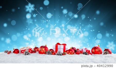 Christmas gift boxes and balls on snow. 40412990