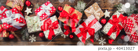 Christmas gift boxes placed on wooden planks 40413027