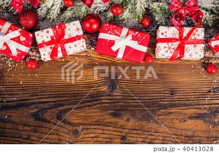 Christmas gift boxes placed on wooden planks 40413028