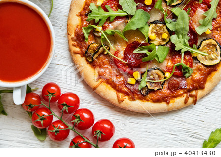 Delicious italian pizza served on wooden table Delicious italian pizza served on wooden table 40413430