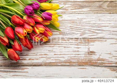 fresh tulips arranged on old wooden background 40413724