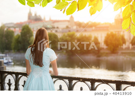 Brunette girl watching old town center 40413910