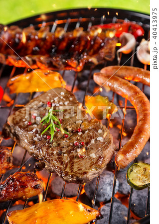 Various kind of meat served on grill 40413975