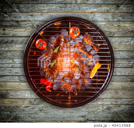 Various kind of meat served on grill 40413988
