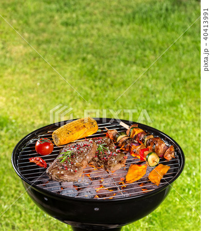Various kind of meat served on grill 40413991