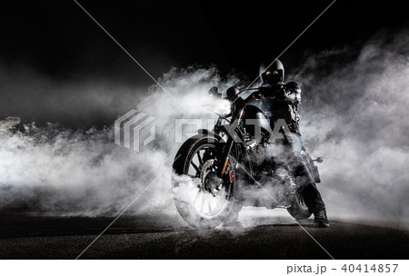 High power motorcycle chopper with man rider at night 40414857