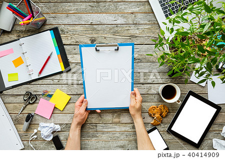 Man hands holding blank reference sheet 40414909