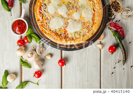 Rustic pizza with ingredients, top view Rustic pizza with ingredients, top view 40415140