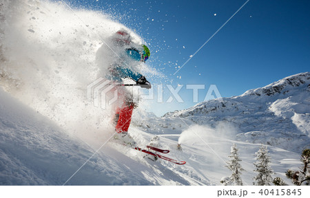 Man freerideer running downhill 40415845