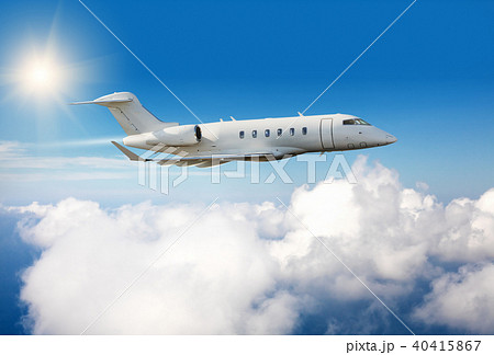 Private jet plane flying above clouds 40415867