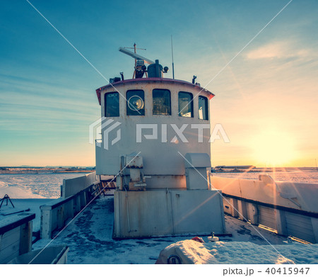Old fisherman boat in Iceland in grunge colored design 40415947