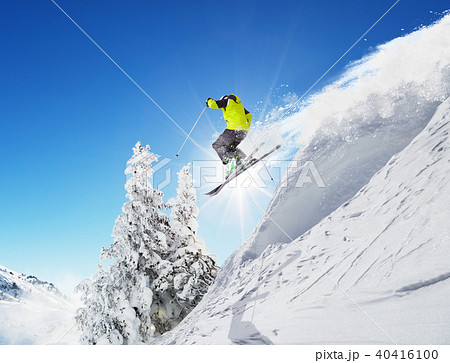 Skier at jump in Alpine mountains Skier at jump in Alpine mountains 40416100