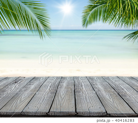 Empty wooden planks with blur beach on background Empty wooden planks with blur beach on background 40416283