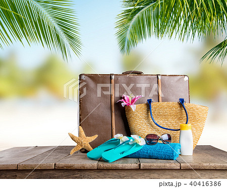 Suitcase and accessories for travelling on wood Suitcase and accessories for travelling on wood 40416386