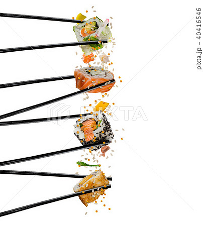 Pieces of sushi with wooden chopsticks, separated on white background. Pieces of sushi with wooden chopsticks, separated on white background. 40416546
