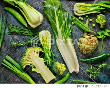 Collection of fresh green vegetables on black stone 40416958