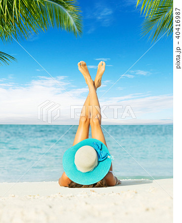 Back view of long haired young woman in swimsuit Back view of long haired young woman in swimsuit 40416987
