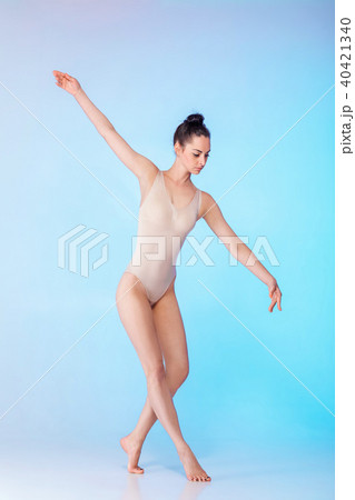 slim gymnast in beige swimsuit 40421340