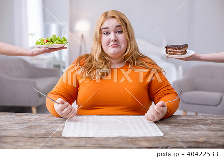 Sad overweight woman being on a diet 40422533