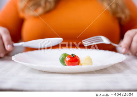 Stout woman being on a healthy diet 40422604