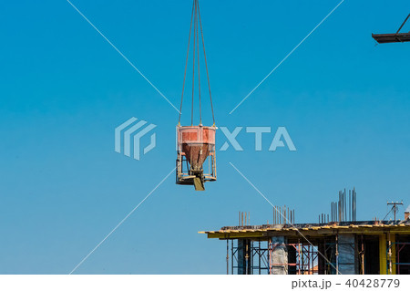 Construction crane builds new building Construction crane builds new building 40428779