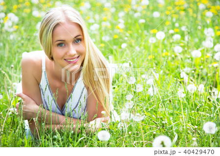 Beautiful young woman among the flowers Beautiful young woman among the flowers 40429470