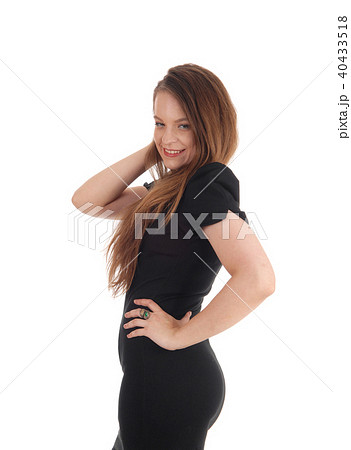 Beautiful brunette woman in a black dress Beautiful brunette woman in a black dress 40433518