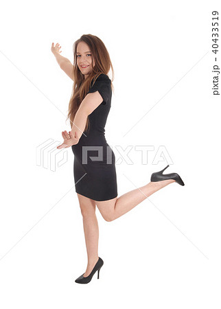 Beautiful woman dancing in a black dress Beautiful woman dancing in a black dress 40433519