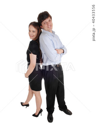 Lovely couple standing back to back Lovely couple standing back to back 40433556