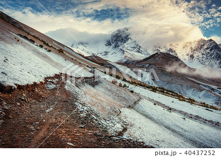 Mountain landscape of snow-capped mountains in the mist 40437252