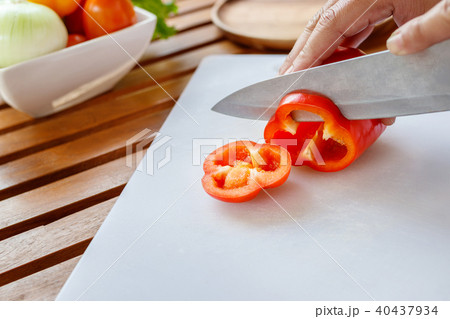 Chef preparing vegetable for cooking. 40437934