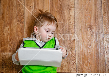 Portrait of a little boy with a tablet pc 40441253