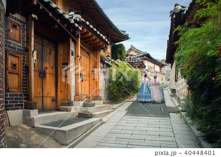 Woman walking at Bukchon Hanok Village in Seoul. 40448401