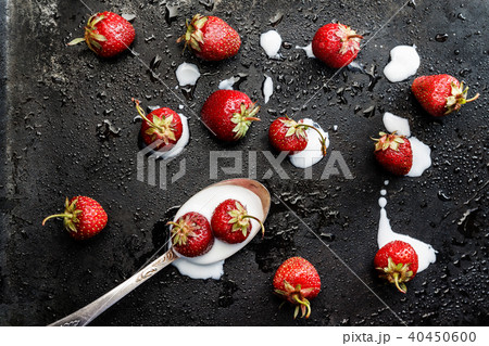 on a dark wet background spilled from a spoonful 40450600