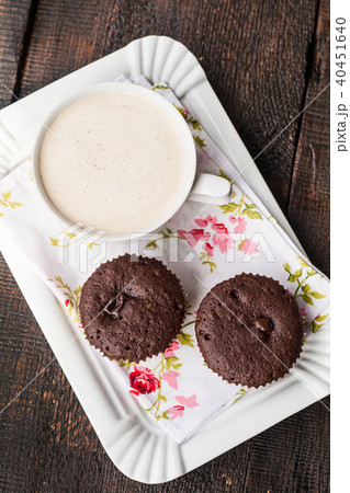 chocolate muffins, cakes and cup of coffee chocolate muffins, cakes and cup of coffee 40451640