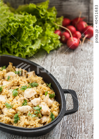 Pilaf rice-curry with chicken and salad in the  40451683