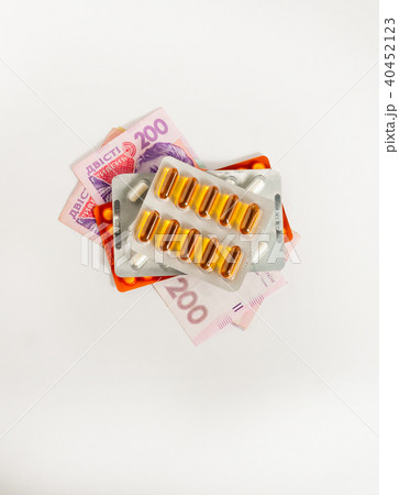 pills on money on a white background, concept pills on money on a white background, concept 40452123