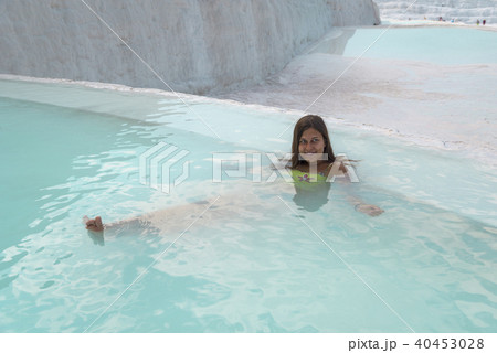 Girl in Pamukkale natural pool 40453028