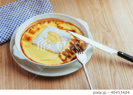 Delicious cheese casserole in a ceramic pot. Delicious cheese casserole in a ceramic pot. 40453484