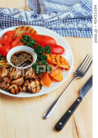 grilled vegetables with sauce on a wooden background grilled vegetables with sauce on a wooden background 40455394