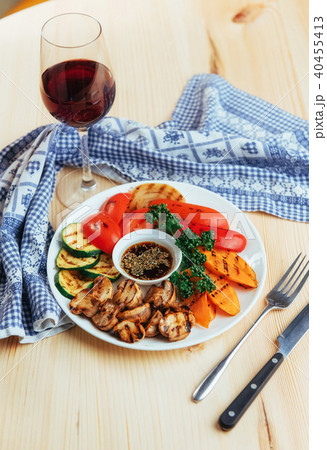 grilled vegetables with sauce on a wooden background grilled vegetables with sauce on a wooden background 40455413