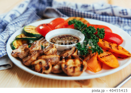 grilled vegetables with sauce on a wooden background grilled vegetables with sauce on a wooden background 40455415
