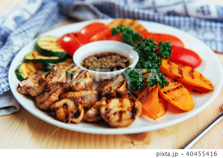 grilled vegetables with sauce on a wooden background grilled vegetables with sauce on a wooden background 40455416