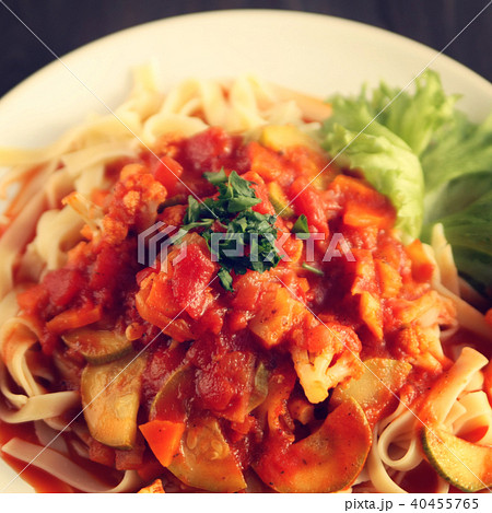 Cauliflower, courgette and tomato stew. Pasta. 40455765
