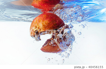 Garnet in the water on a white background Garnet in the water on a white background 40456155