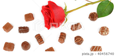Assortment of chocolates and red rose isolated Assortment of chocolates and red rose isolated 40456740