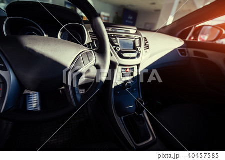 Modern car interior dashboard and steering wheel 40457585