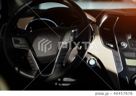 Modern car interior dashboard and steering wheel. Modern car interior dashboard and steering wheel. 40457676