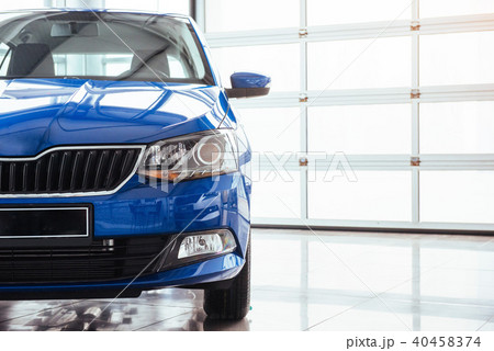 The headlights and hood Blue car 40458374